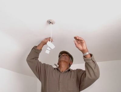 stock-photo-512505-fixing-the-light Management Services